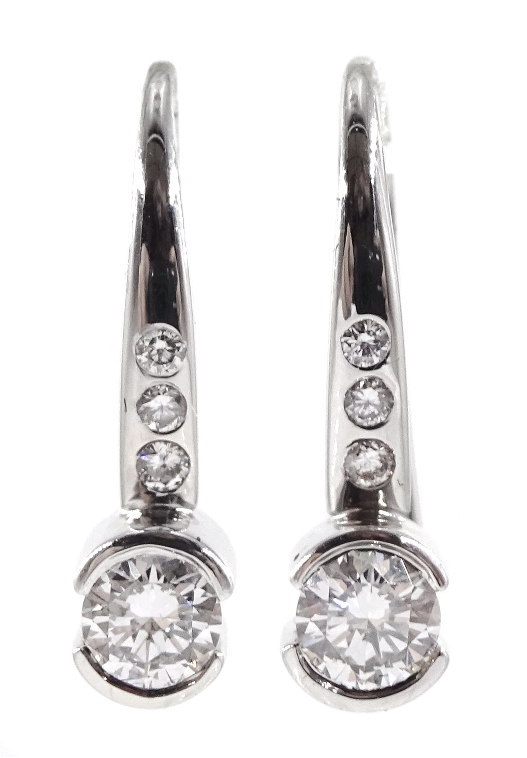 Pair of 18ct white gold diamond pendant half bezel set earrings, hallmarked, total diamond weight approx 0.26 carat