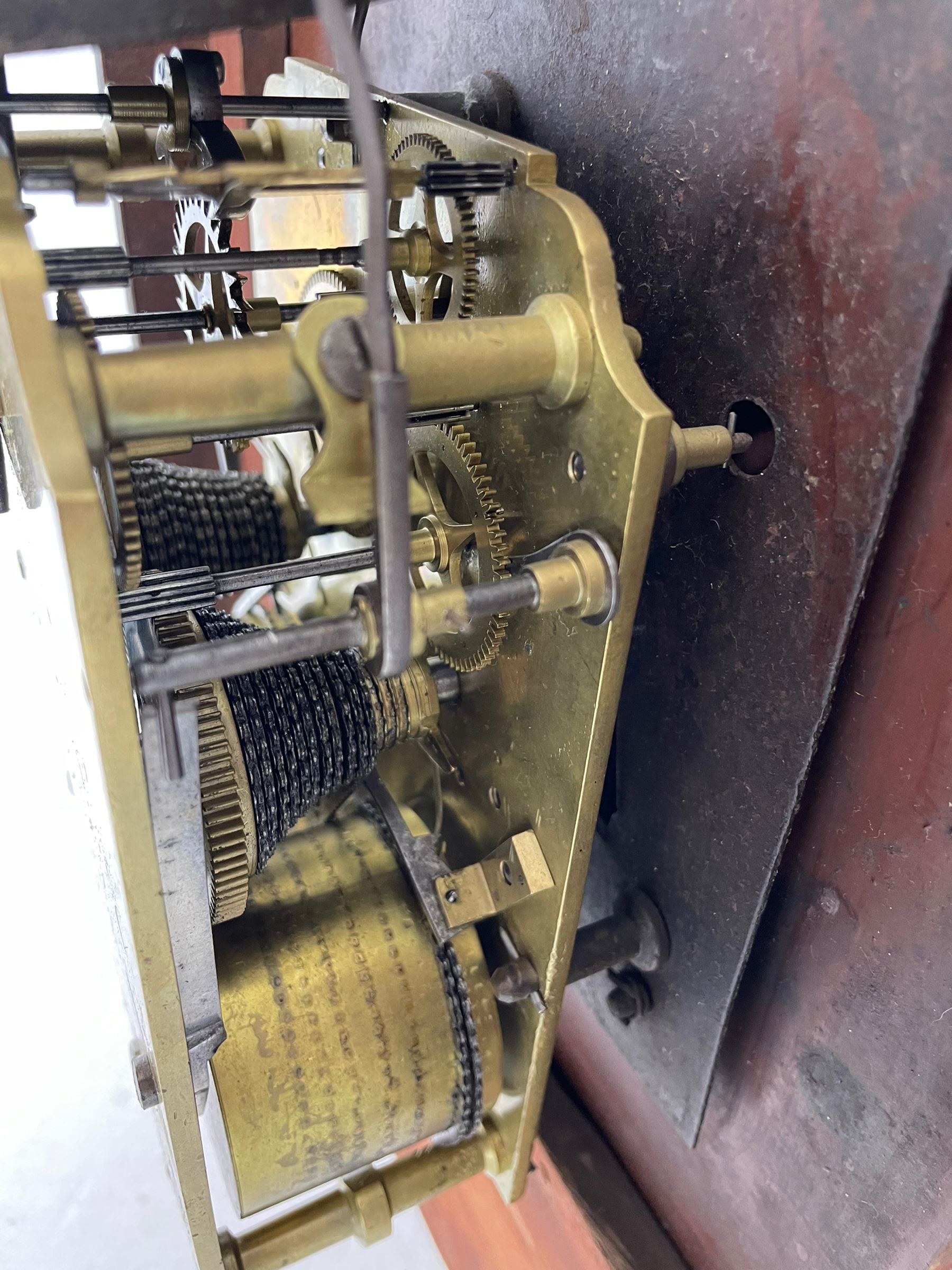 Joseph Critchley of Liverpool -  early 19th century twin fusee 8-day rosewood and mother of pearl inlaid drop-dial wall clock c1820, inlaid circular wooden dial surround with carved ears representing grapes and vine leaves, glazed box with a scroll carved surround, curved base and pendulum adjustment door, 14” painted dial with Roman numerals, minute track, and pierced steel hands within a cast brass bezel and flat glass, dial pinned to a four pillar chain driven fusee movement striking the hours on a bell. With pendulum and key.