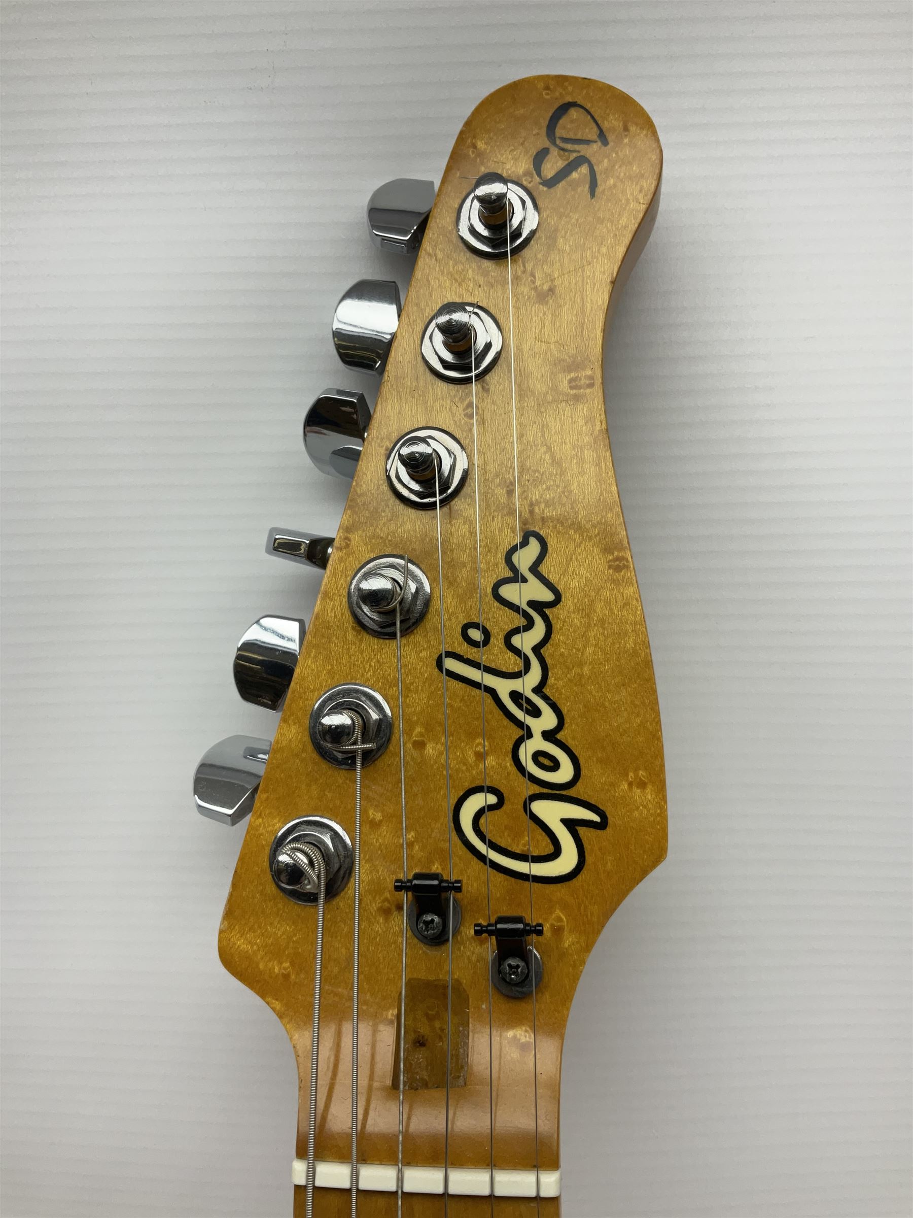 Canadian Godin SD electric guitar in two-tone purple/white with bird's eye maple neck and tremolo, serial no.98455463, L100cm overall; in soft carrying case.