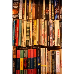  Over sixty paperback books of James Bond and Ian Fleming interest  