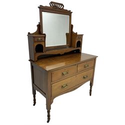 Edwardian walnut dressing table chest, raised back fitted with bevelled swing mirror and trinket drawers, above two short and one long drawer, raised on turned supports 