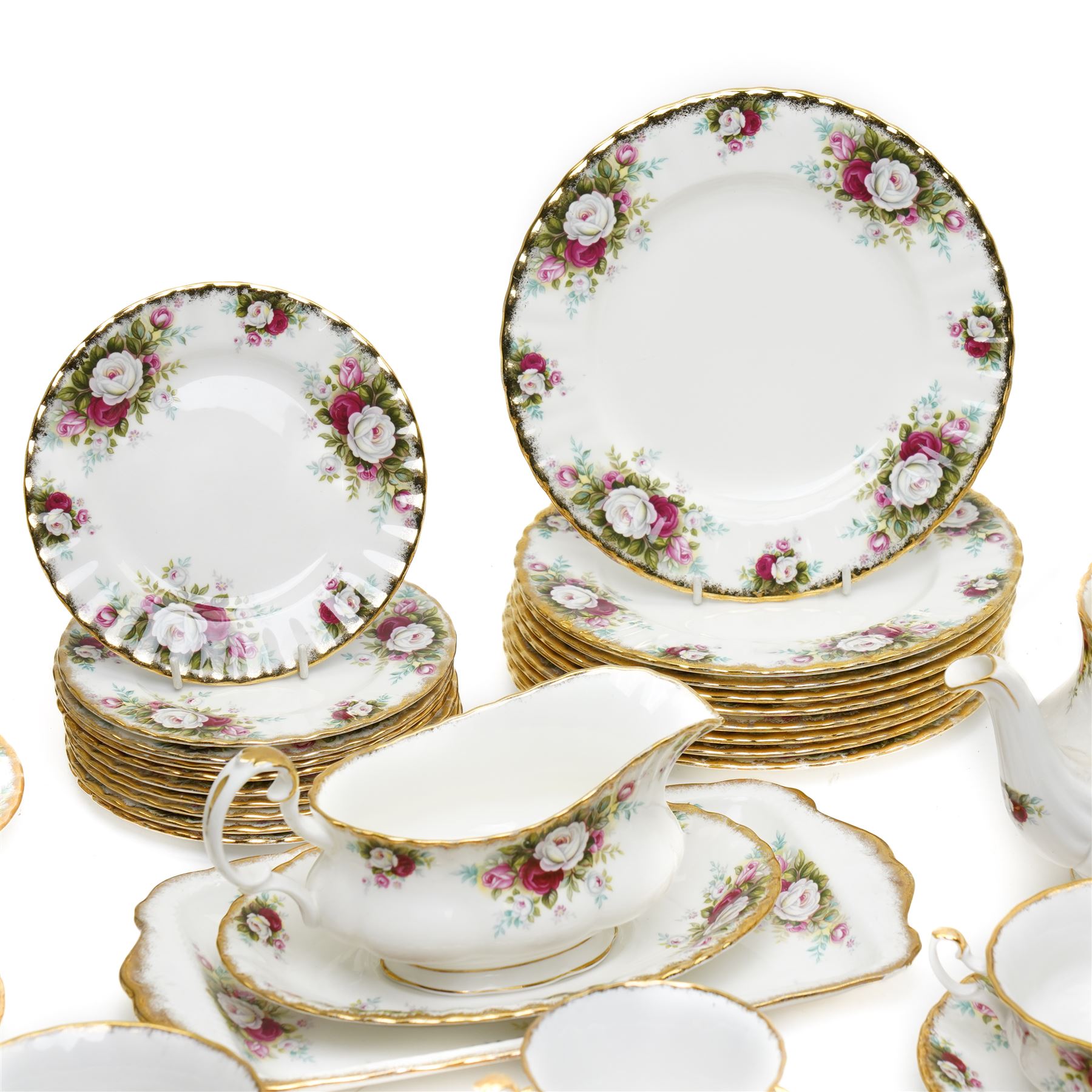 Royal Albert Celebration pattern tea and dinner wares, comprising covered tea and coffee pot, seven dinner plates, oval serving dish, gravy boat and saucer, nine coffee cups and ten coffee cup saucers, seven teacups and eight teacup saucers, eight soup bowls and saucers, rectangular serving tray, ten side plates, etc, approximately 88 pieces in total