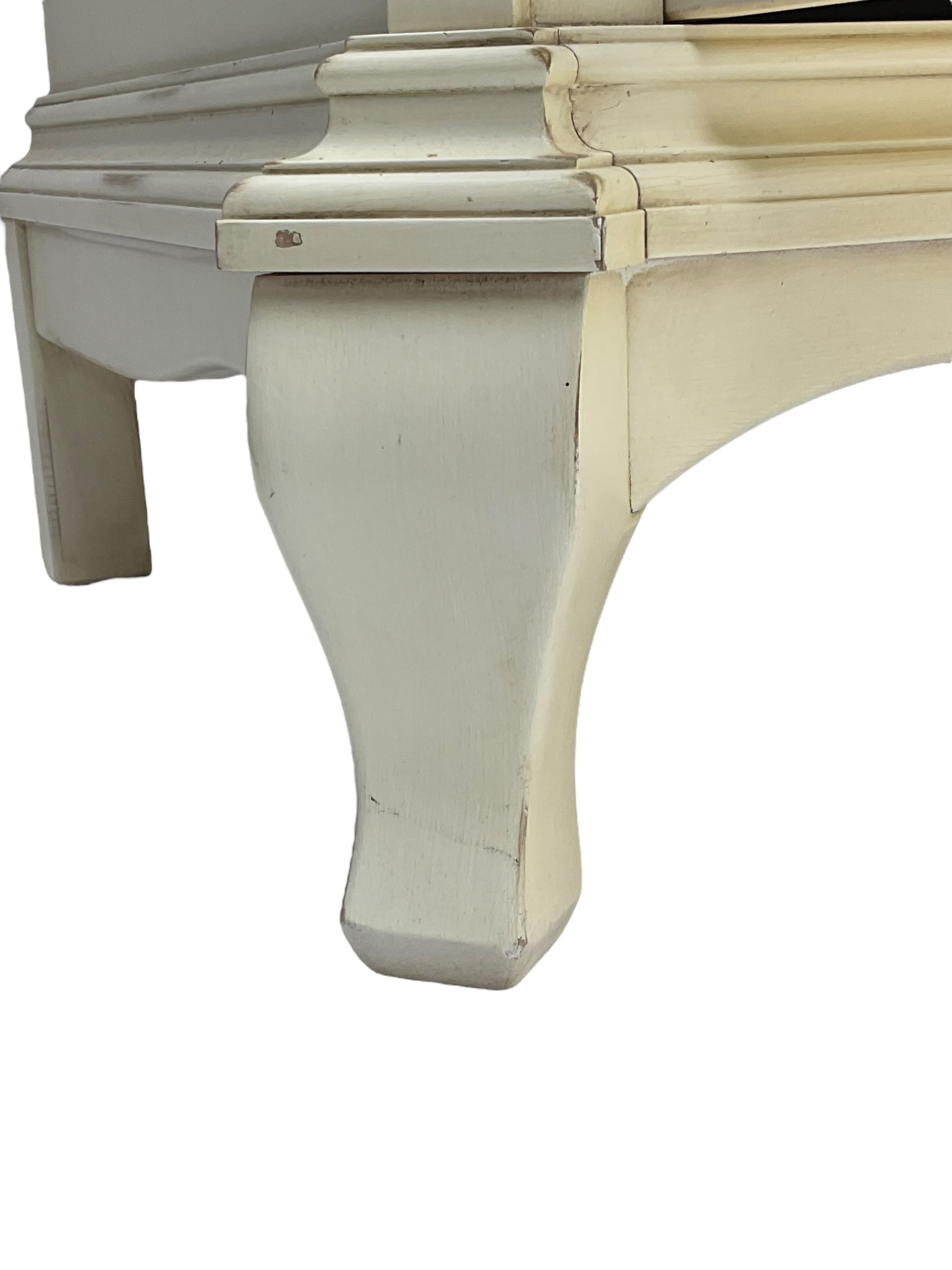 French design cream painted armoire wardrobe, shaped top with shell and flower head pediment, enclosed by two mirror glazed doors, the base fitted with single drawer