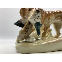 Royal Dux porcelain hunting dog with a bird, printed mark beneath, L36cm