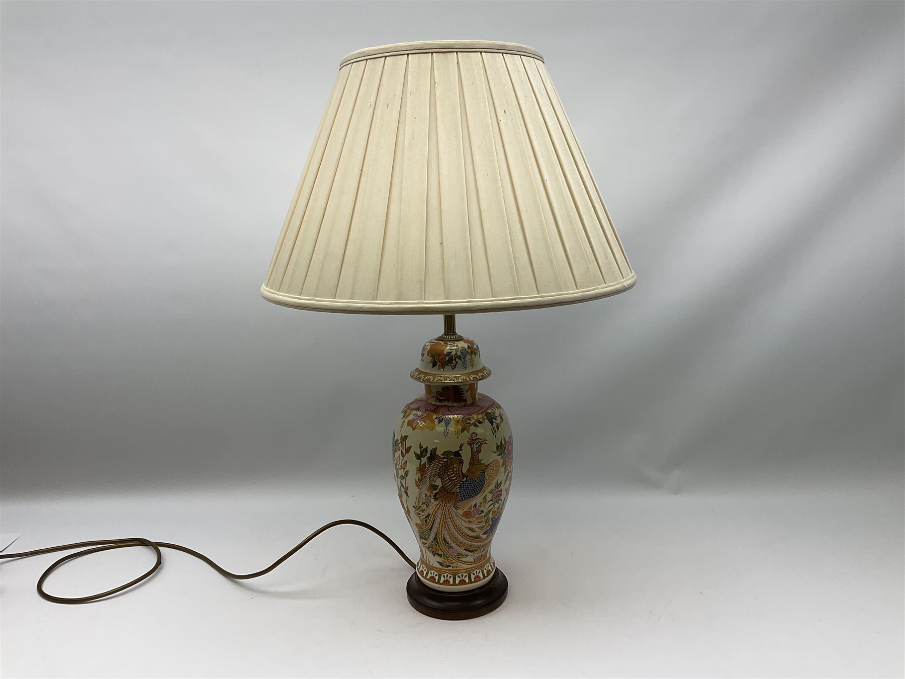 Table lamp of baluster form, decorated in the Oriental style with phoenix and dragon amidst blossoming flowers, with plated cream fabric shade, lamp base not including fixtures H35cm