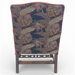 Early 20th century Chippendale revival Gainsborough elbow chair, rectangular upholstered back and seat covered in foliate patterned fabric, with open arms carved to the terminals and supports with pierced and geometric detail, raised on square section legs with blind fretwork panels