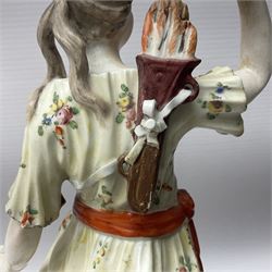 18th century Derby figure of Diana the huntress, circa 1760, modelled reaching for an arrow from quiver across her back, with recumbent hound at her feet, upon a scrolled base with bocage detail, H27.5cm