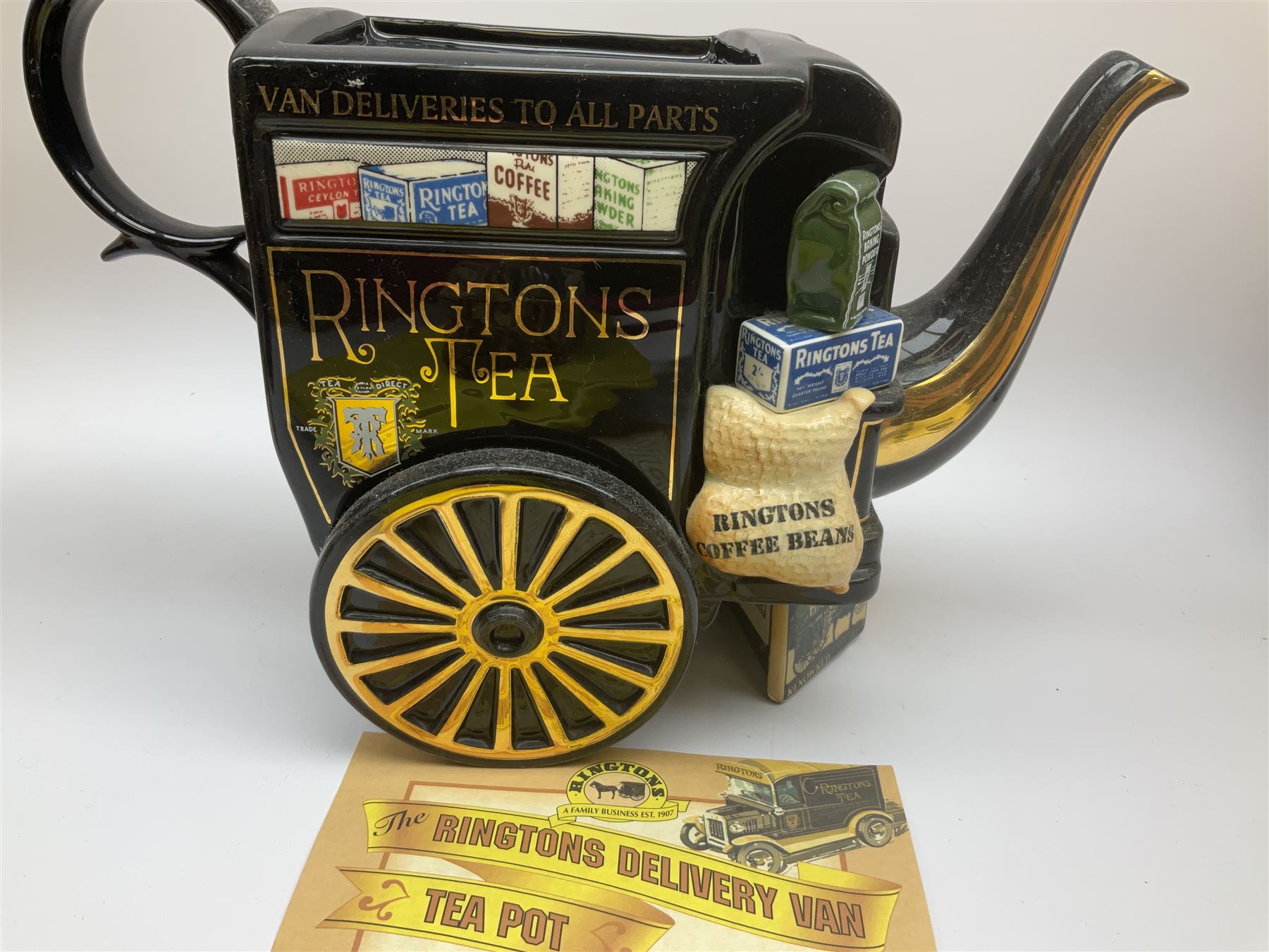 Ringtons novelty teapots, comprising the Ringtons Delivery Van teapot, and the Tea Merchant teapot, both with boxes and certificates of ownership.