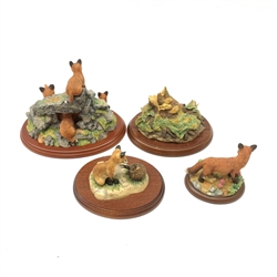 Four Border Fine Arts figures, comprising Secret Places, Model no A0400, Rocky Den (Fox Family), on wooden base, Fox Cub & Hedgehog, model no FE1, on wooden base, A Brave New World, model no B0368, on wooden base, and Mamals Standing Fox, model no A7679, with box. (4). 