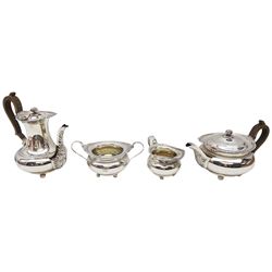 Early 20th century silver four piece tea service, comprising teapot, coffee pot, twin handled open sucrier and milk jug, each of bellied form with gadrooned beaded rim with cast shell and foliate detail, the tea and coffee pots with acanthus decoration to spouts and curved wooden handles, the sucrier and milk jug with acanthus and flower head detailed curved handles, each upon four ball feet, hallmarked James Dixon & Sons Ltd, Sheffield 1918, including handles coffee pot H22.5cm teapot H15cm, approximate gross weight 76.35 ozt (2374.8 grams)

