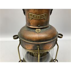 Copper and brass ship’s lamp marked ‘Anchor’, H25cm, Feuer hand storm lantern, Bialaddin Model 315 paraffin lamp and an Anchor lamp (4)
