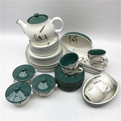 Denby stoneware in Green Wheat design, comprising of eight cups and saucers, teapot, three soup bowls with covers, eight tea plates, six dissert plates, five dinner plates, two oval side dishes and two oblong side dishes. 
