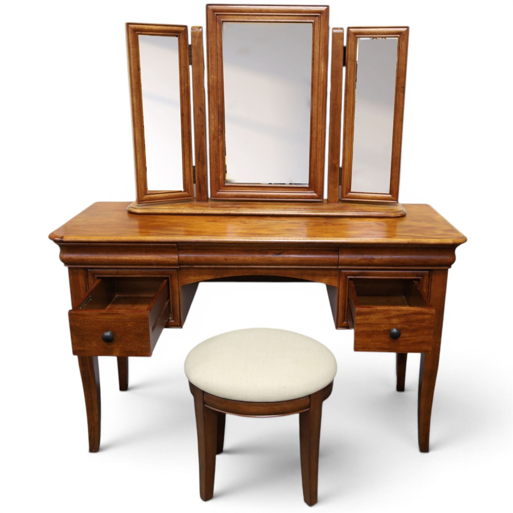 Willis & Gambier - mahogany dressing table, three part mirror and stool, the dressing table with rectangular top with chamfered corners, over two baize lined frieze drawers, kneehole recess and a single drawer either side, three part mirror with central tilting mirror on a moulded plinth base, with oval beige padded stool 