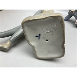 Four Lladro figures, comprising Touch of Class no 5377, Boy Student no 4517, Ocean Beauty no 5785 and Carnival Couple no 4882, largest example H45cm