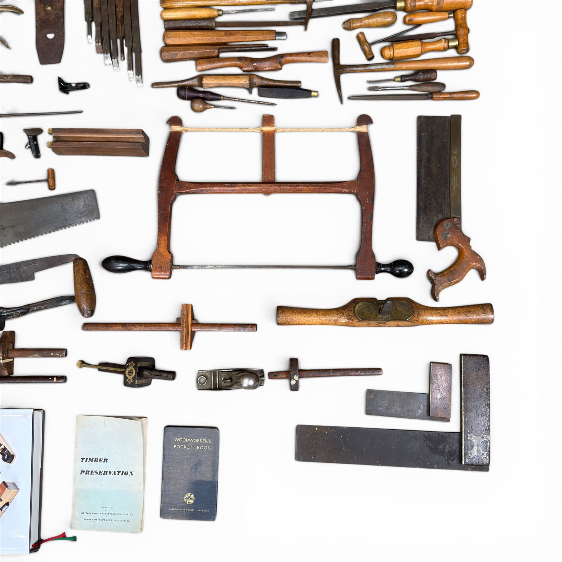 Collection of planes and woodworking tools including wood planes, chisels, hammers etc along with three books (Antique Woodworking Tools, Timber Preservation and Woodworkers Pocket Book)