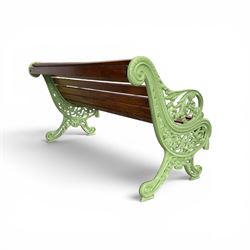 Pair of Victorian design cast iron and slatted wooden garden benches, the ornate pierced end supports of scrolled form, the pierced acanthus leaves interspersed with trailing flowerheads, with tassels to the front, raised on splayed feet, the supports in pale sage green painted finish