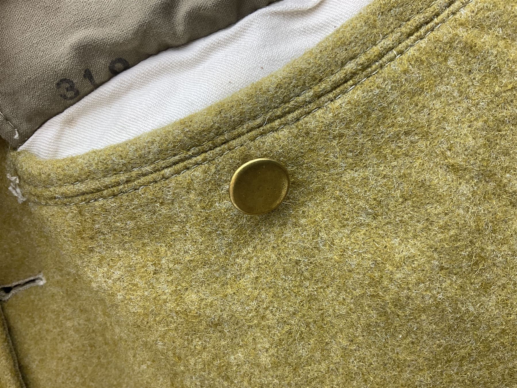 Japanese Type 38 winter tunic, the lining stamped with various Japanese character marks