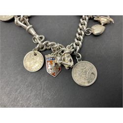 Silver curb link charm bracelet, with fifteen charms including acorn, bear, telephone and coins etc