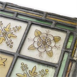 Edwardian stained glass panel, with central painted E motif surrounded by flowers and Yorkshire roses, H47cm