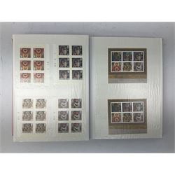 Queen Elizabeth II mint decimal stamps, housed in a stockbook, face value of usable postage approximately 415 GBP