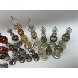 Bohemian glass perfume bottles, with etched and gilt decoration and stoppers modelled as twisted flames, tallest H20cm (22)