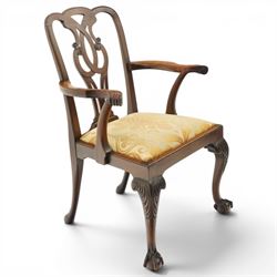 Late 19th century Chippendale style mahogany desk chair, with pierced splat and shaped and scrolled arms, raised on front claw and ball supports