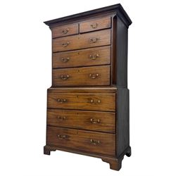 George III mahogany chest on chest, the upper section with two short over three long drawers with swan neck handles flanked by canted corners, inlaid with boxwood stringing below a dentil cornice. The lower section with three long drawers, supported on bracket feet 