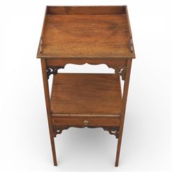 George III mahogany two tier night stand, rectangular tray top with three quarter gallery and shaped cut corners, pierced fret brackets to the apron, fitted with a single drawer to the lower tier, raised on slender square section legs