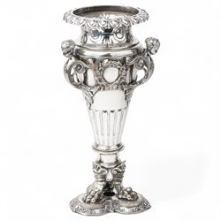 19th century silver plated vase of tapering form with lappet border and three caryatid han...