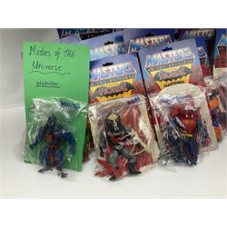 Thirty-one Masters of the Universe He-Man figures re-bagged on original backing cards;  two others lacking backing cards; boxed Modulok figure; bag of weapons and accessories; Roton, two horses and two battle cats; 1986 & 1987 Annuals; Ladybird and other story books; Panini sticker album; instructions etc