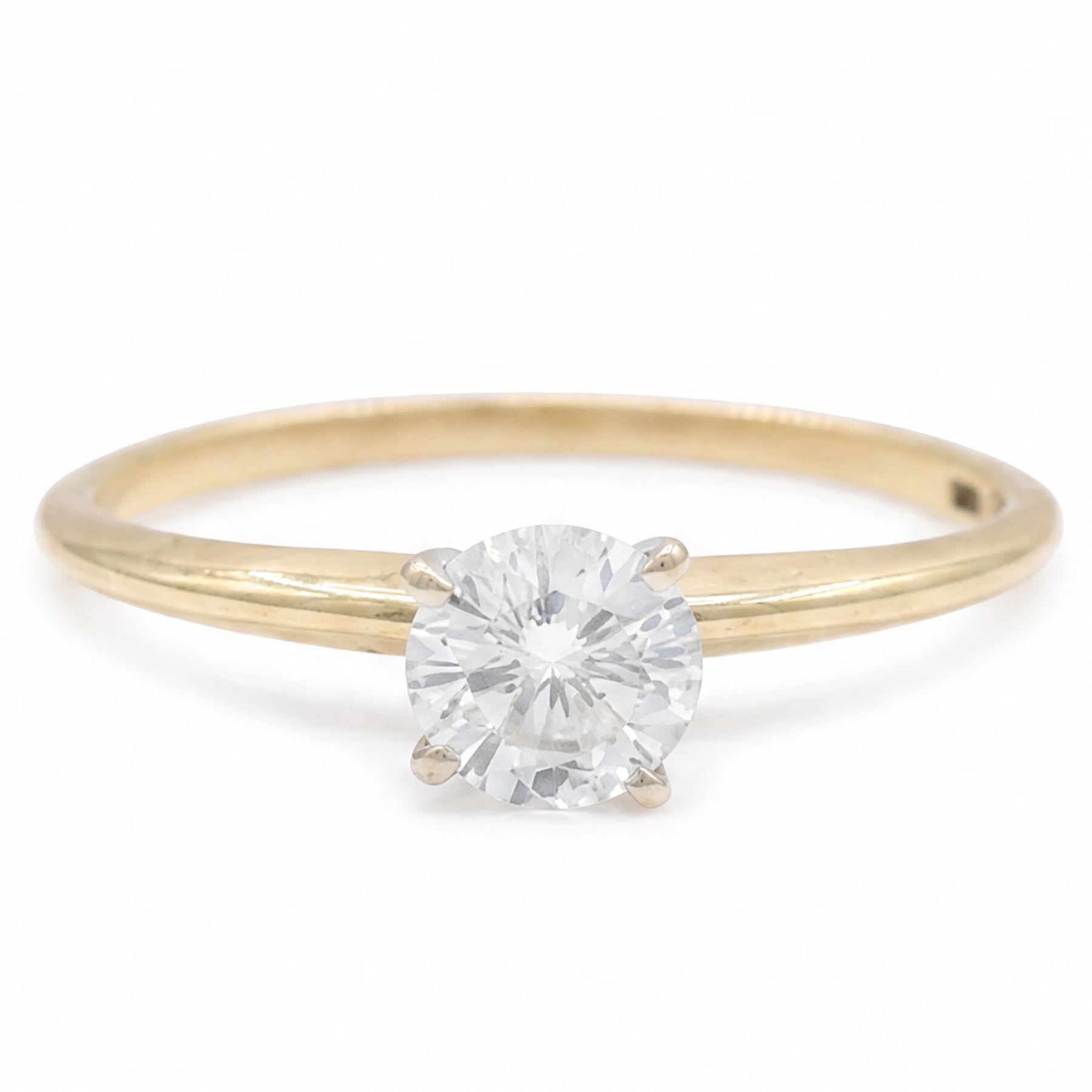 14ct gold diamond ring, four claw set with a single round brilliant cut diamond of 0.61 carat, stamped