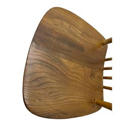 Ercol - pair of mid-20th century highback 'Windsor' chairs, curved top rail over six vertical spindles and shaped seat, on tapering cylindrical supports with stretchers