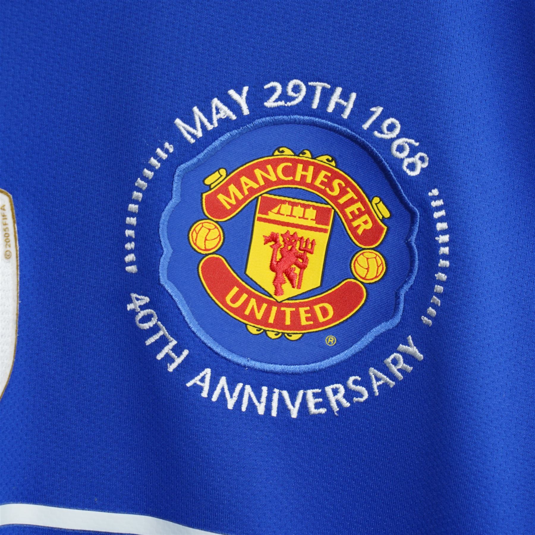 Manchester United Nike blue 40th anniversary shirt, European Cup Final programme Manchester United against Bayern Munich 1999 and other Man. Utd. programmes etc