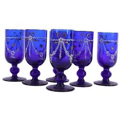 19th century style blue glass decanter and six drinking glasses, the decanter of mallet form with lozenge shaped stopper, all with white enamel and gilt swag decoration, decanter H34cm, drinking glasses H11.5cm