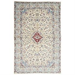 Central Persian Nain hand-knotted rug, ivory field with central medallion in tones of indi...