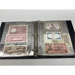 World banknotes, including Queen Elizabeth II The States of Jersey one pound 'DB202703', five pounds 'BB527762' and ten pounds 'AB651481', reserve bank of New Zealand two dollars '1L3 741894', King George V Straits Settlements one dollar 1st January 1935 'F/83 28924', various Bank of England notes etc, housed in two ring binder albums