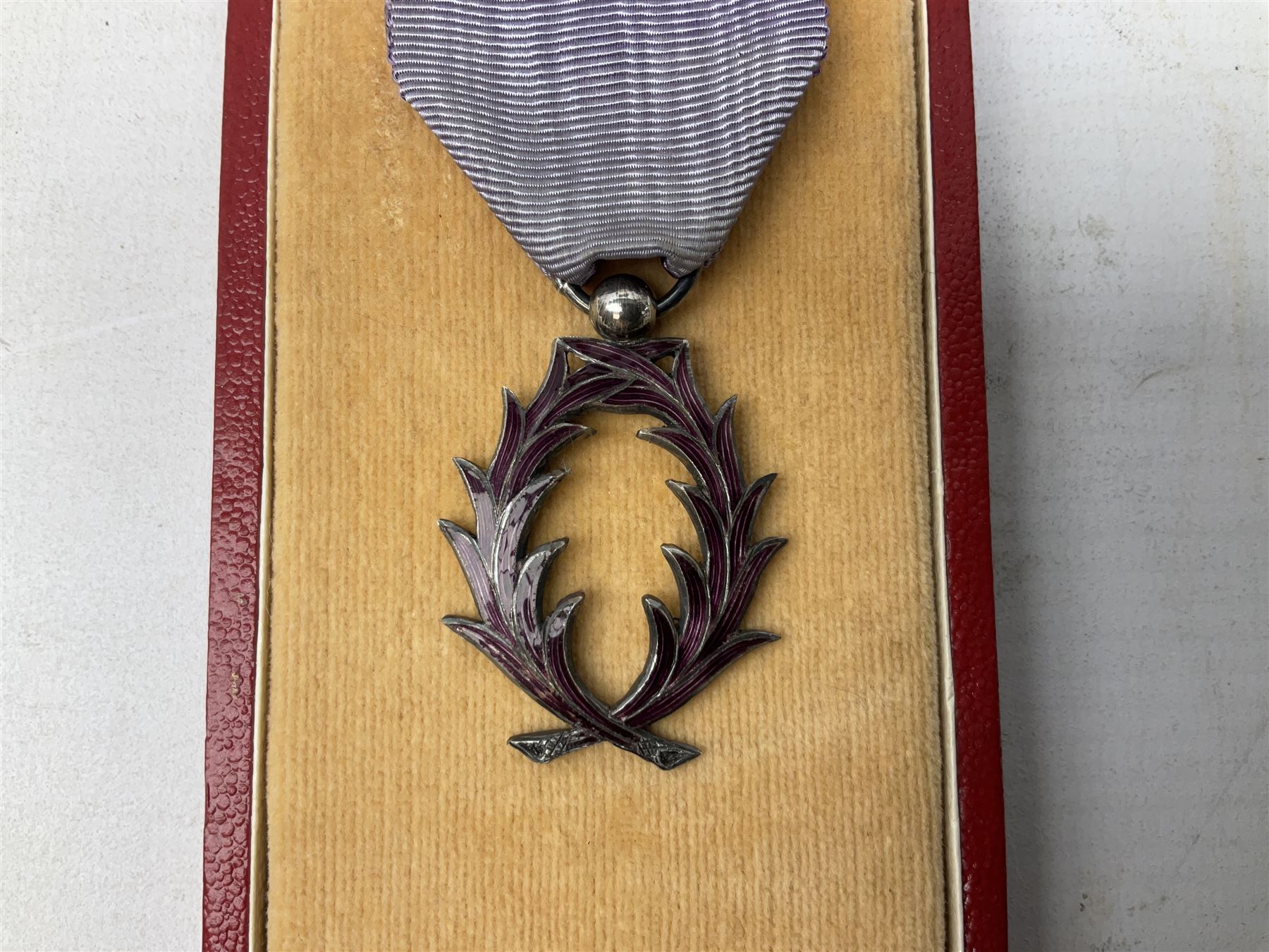 Five continental medals - WW1 Belgian Cross of Fire; WW1 French Croix De Guerre; French Croix De Combattant; French Republic Workers silver merit awarded to L. Mounet 1950; and boxed French Palmes Universitaires Officier d'Academie silver and enamel wreath (5)