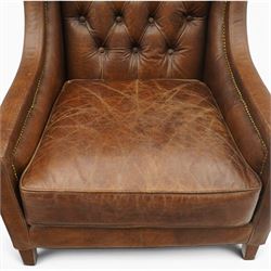 Timothy Oulton - pair of wingback armchairs upholstered in back-buttoned chocolate brown leather with loose seat cushion, raised on square tapering feet