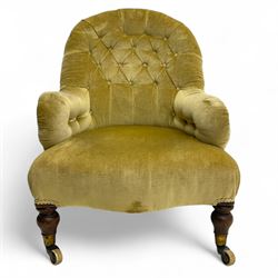 Late 19th century button-back nursing chair, upholstered in olive-green velvet, shaped back with padded arms, raised on turned front supports terminating in castors