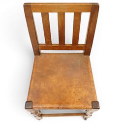 Mouseman - 1940s oak side chair, the slat-back over a slung leather seat, raised on octagonal front supports united by box stretcher, carved with slim mouse signature, by the workshop of Robert Thompson of Kilburn
