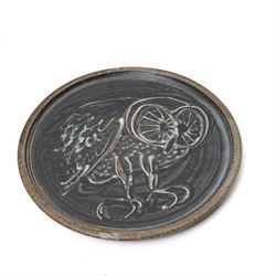 Mick Dixon studio pottery plate, decorate with an owl, impressed marks to base, D27cm; together with slipware dish, impressed BH initials to base, D32cm, a Poole pottery plate and a jug, H25cm (4)