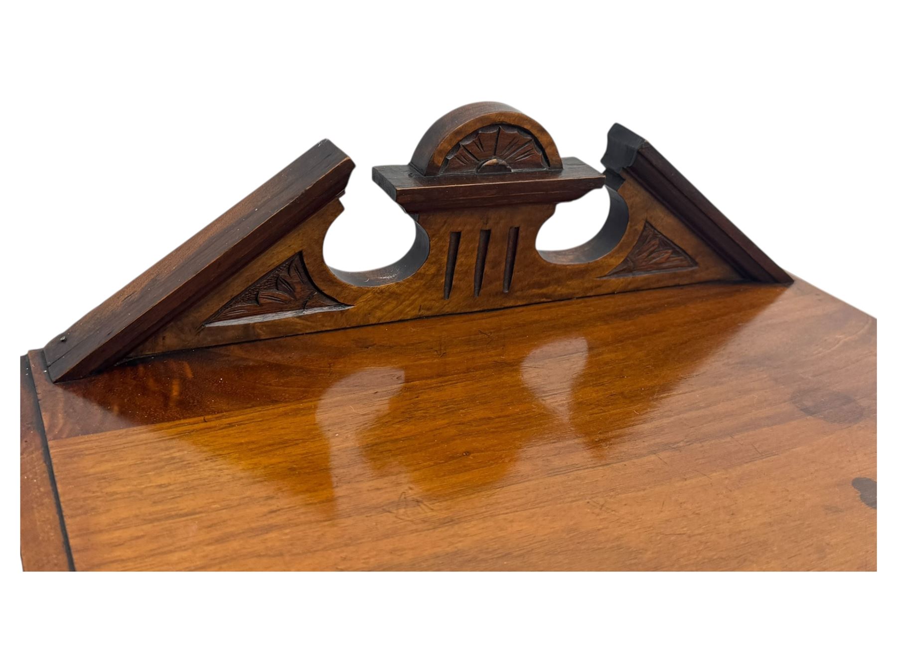 Victorian walnut bedroom suite - wardrobe, dressing chest and bedside cupboard, comprising a full-length wardrobe with broken pediment and central mirrored door, large lower drawer, a matching dressing table with bevelled swing mirror over two trinket drawers and two short drawers over two long drawers, and a single-door bedside cupboard, all with moulded edges, decorative panel work and shaped aprons