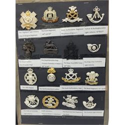 Collection of thirty-two reproduction military badges, including Royal Scots Fusiliers, Royal Lincolnshire Regiment, The Boarders Regiment etc. 