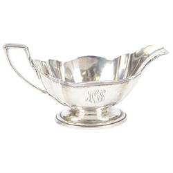 American silver sauce boat, with shaped rim and engraved to body with monogram, upon oval stepped foot, stamped Sterling and with maker's marks for Gorham, H9.5cm