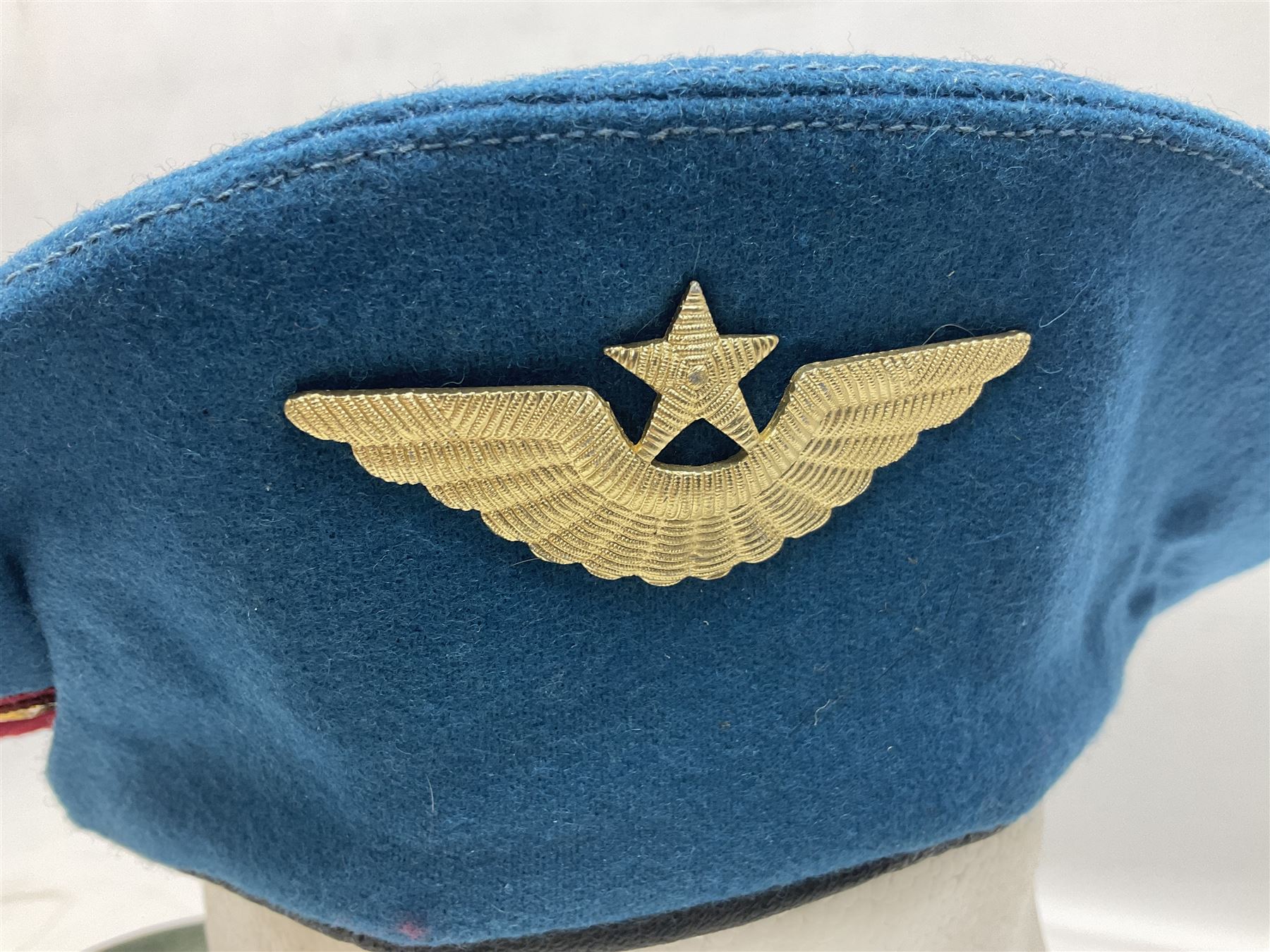 Four paratrooper berets - Russian, Italian, British and Foreign Legion; all with badges (4)