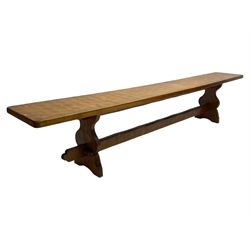 Gnomeman - adzed oak narrow bench, rectangular seat on shaped end supports united by pegged stretcher, carved with gnome signature, by Thomas Whittaker, Little Beck 