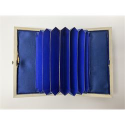 Victorian mother of pearl tea caddy, of rectangular bow-fronted form, the body with floral, bird and geometric engraved mother of pearl panels, white metal shield plaque to the cover inscribed with the initials G.J.A and similar escutcheon, the two division interior with ivory edging and two panelled mother of pearl lids, on four vegetable ivory bun feet L20cm, together with a similar style mother of pearl card case (2) This item has been registered for sale under Section 10 of the APHA Ivory Act