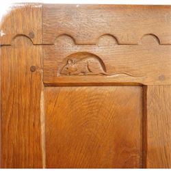 Mouseman - early-to-mid-20th century figured panelled and adzed double wardrobe of large proportions, the arcade carved cresting rail over two doors with adzed and figured oak panels, with wrought metal hinges and latch, relief carved mouse signature, the interior fitted with hanging rail, by the workshop of Robert Thompson, Kilburn