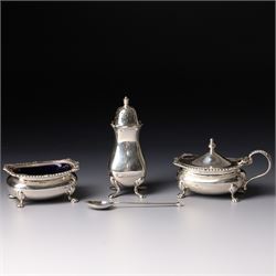 Silver salt and mustard pot with gadrooned edge on paw feet and with blue glass liners Bir...