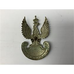 Three WW2 German visor cap badges comprising Police eagle, Political leaders eagle and Norwegian Quisling Party; all with fixings; and WW2 Polish visor cap badge (4)